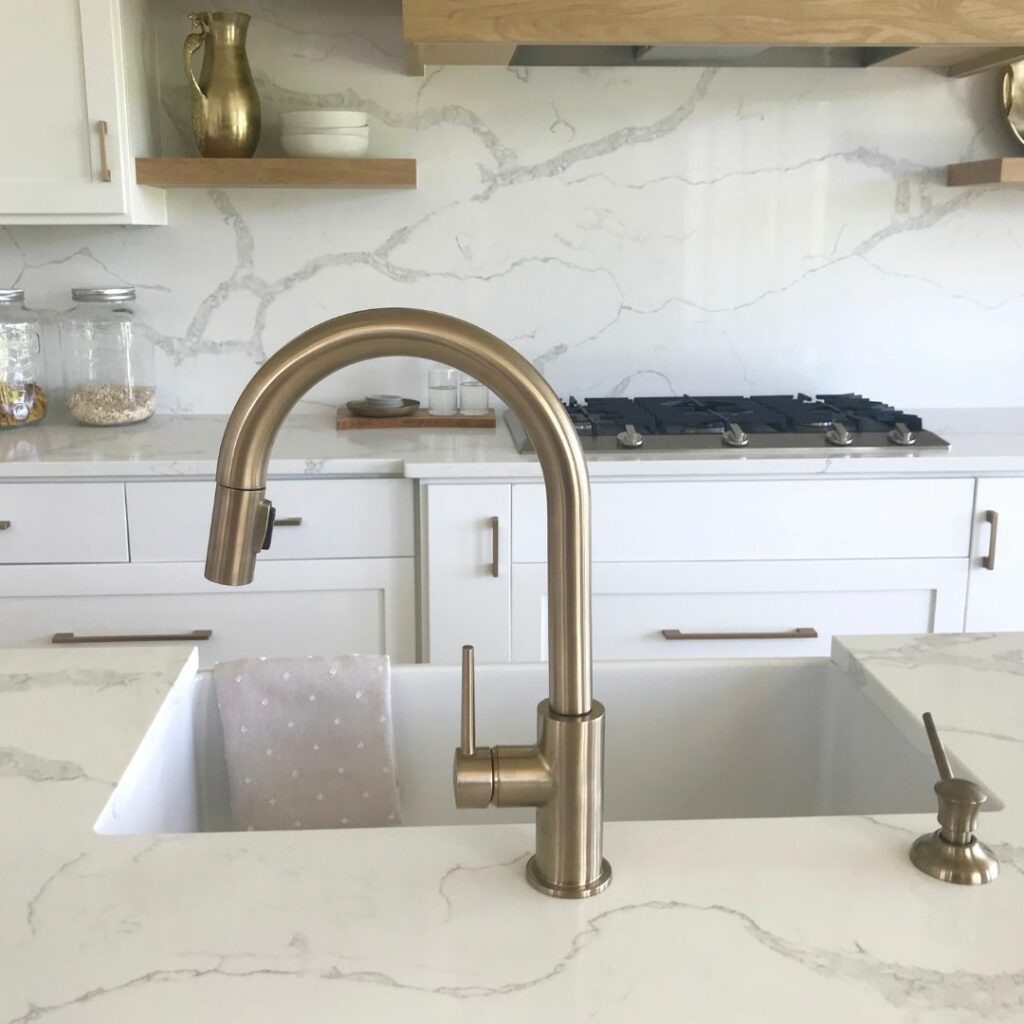 white marble countertop vinyl wrapped around kitchen sink in Dubai apartment