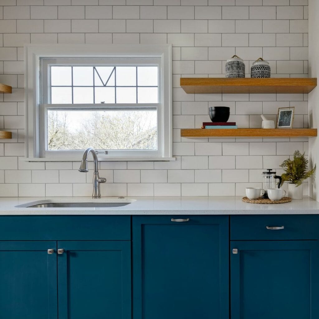 Kitchen backsplash wrapped in plain white tile Dubai