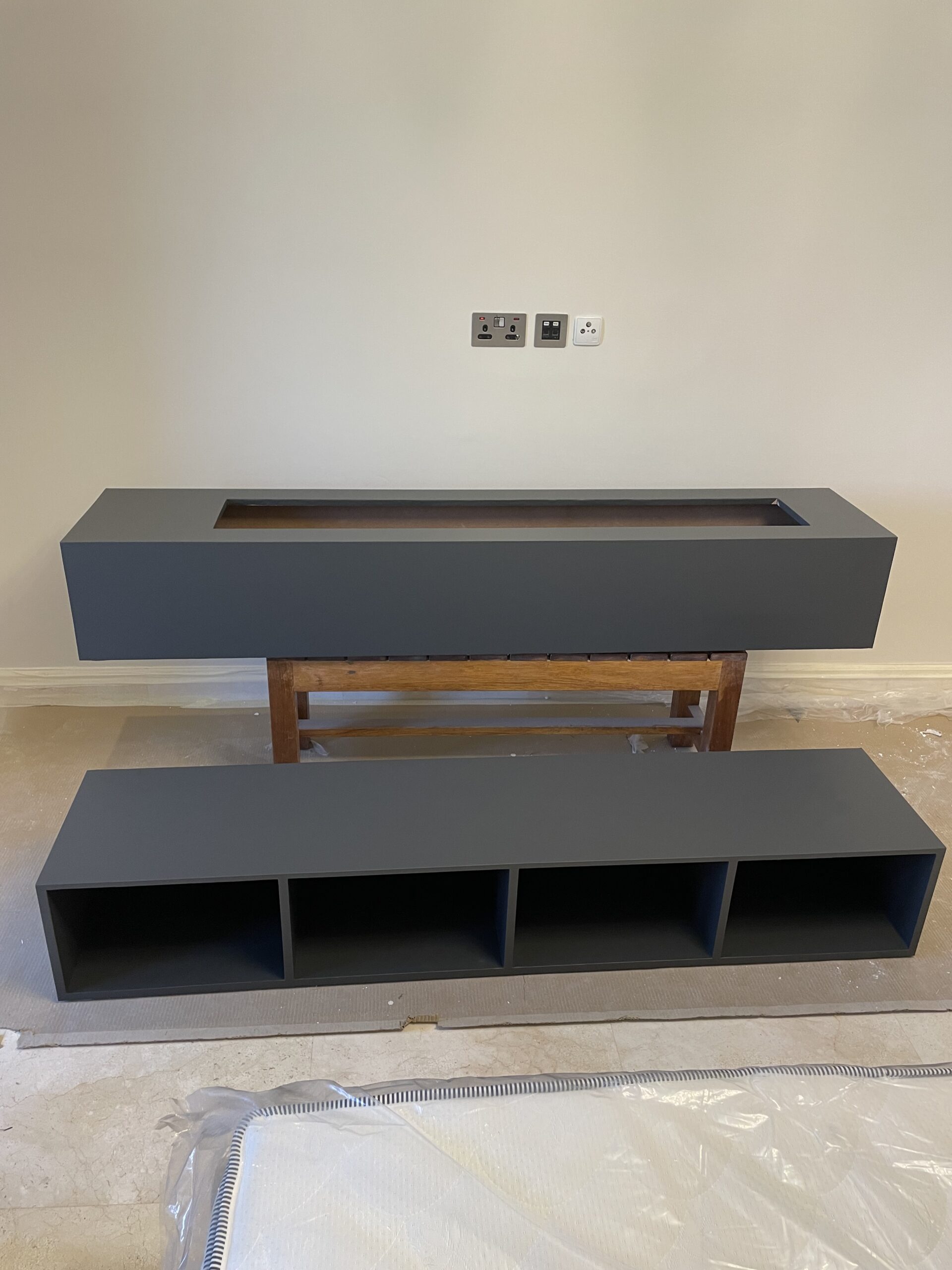 TV unit after wrapping in black vinyl film