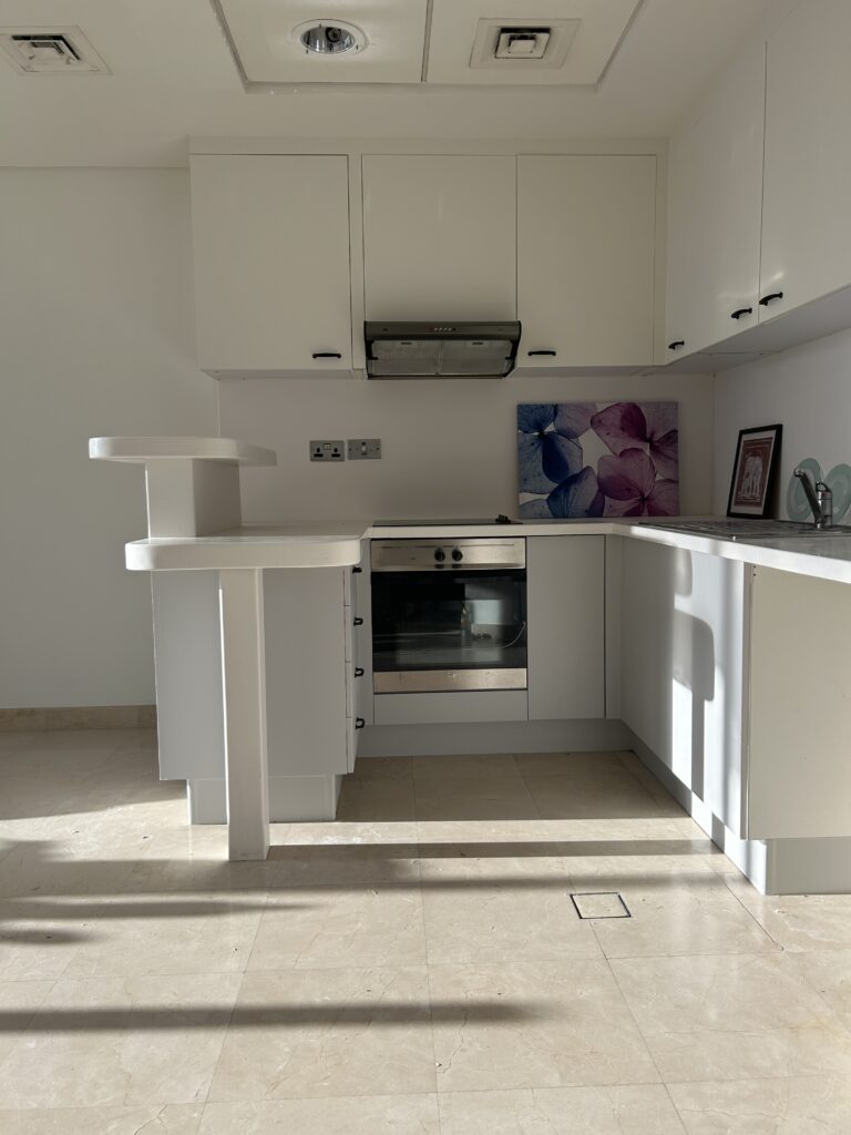 Typicaly Dubai Brown kitchen after wrappingin white