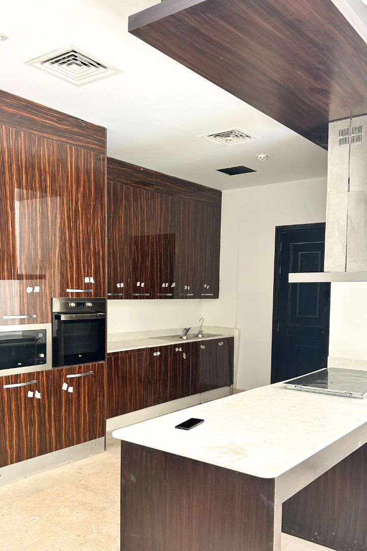 Kitchen wrapping Dubai Before light wood wrap