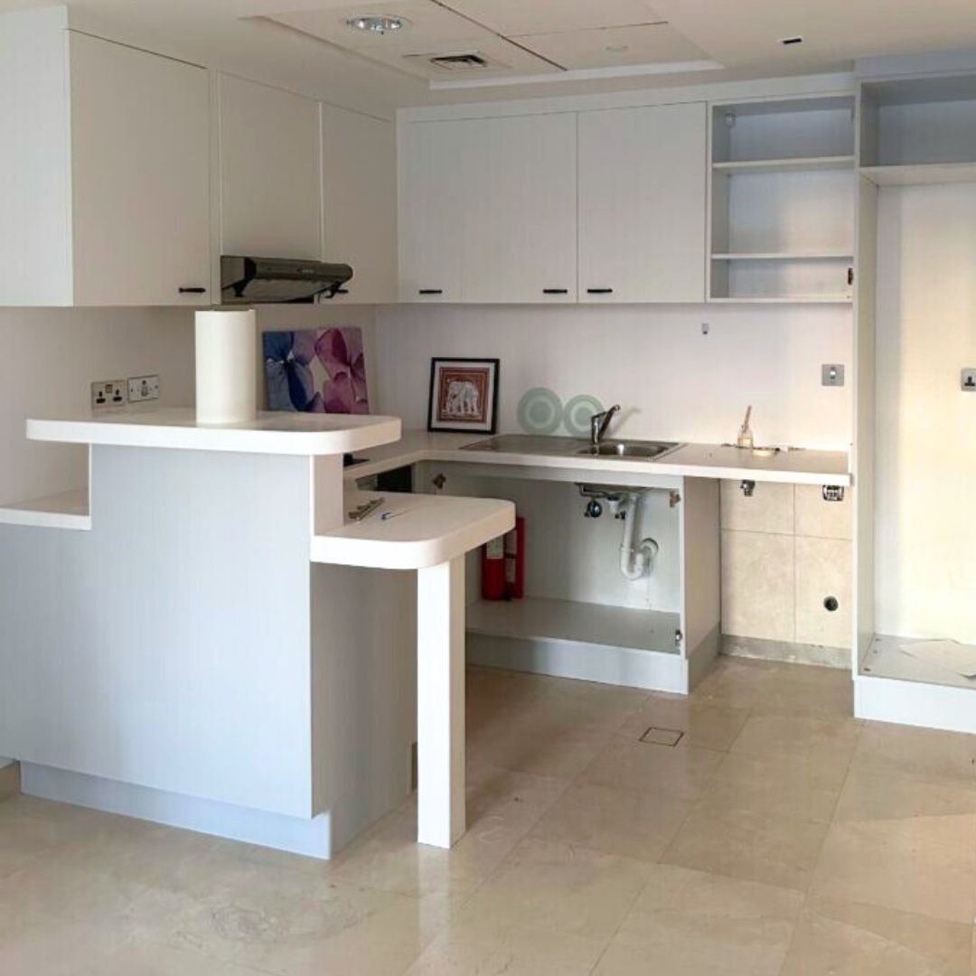 White kitchen after wrapping in grey